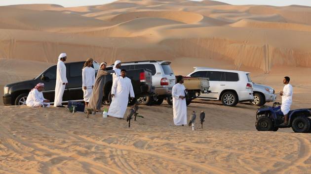 Emirati falcon trainers gather in the Liwa desert. Visitors and participants attending the festival and races are provided with all facilities and services to make camping and accommodations in the Moreeb Dune a unique and extraordinary experience by the organisers. (Karim Sahib/AFP) Emirati falcon trainers gather in the Liwa desert. Visitors and participants attending the festival and races are provided with all facilities and services to make camping and accommodations in the Moreeb Dune a unique and extraordinary experience by the organisers. (Karim Sahib/AFP)