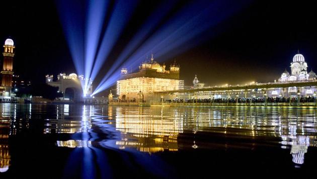 Golden Temple in Amritsar, the home to the Akal Takht or one of the five seats of power of Sikhism, is illuminated on the 350th birth anniversary of Guru Gobind Singh.  (PTI) 
