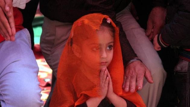 A little girl praying at a gurdwara in Jammu on Thursday. (Nitin Kanotra/HT Photo)