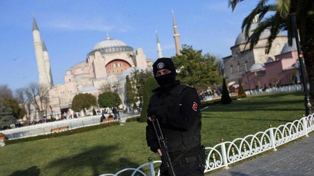 Backdropped by the Byzantine-era Hagia Sophia, one of Istanbul's main tourist attractions, a Turkish police officer patrols in the historic Sultanahmet district in Istanbul. (AP Photo) Backdropped by the Byzantine-era Hagia Sophia, one of Istanbul's main tourist attractions, a Turkish police officer patrols in the historic Sultanahmet district in Istanbul. (AP Photo)