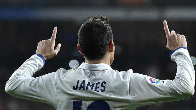 Real Madrid's Colombian midfielder James Rodriguez celebrates after scoring from a penalty kick during the Spanish Copa del Rey (King's Cup) round of 16 first leg football match against Sevilla FC at the Santiago Bernabeu stadium on Wednesday (AFP) Real Madrid's Colombian midfielder James Rodriguez celebrates after scoring from a penalty kick during the Spanish Copa del Rey (King's Cup) round of 16 first leg football match against Sevilla FC at the Santiago Bernabeu stadium on Wednesday (AFP)