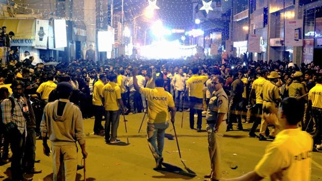 Policemen attempt to manage crowds during New Year's eve celebrations in Bengaluru on December 31, 2016.(AFP File)