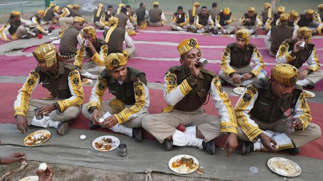 Central Industrial Security Force (CISF) soldiers eat breakfast during a practice ahead of the Republic Day parade in New Delhi, India, Thursday, Jan. 5, 2017. Indians celebrate Republic Day on Jan. 26, marking the day that its constitution came into effect in 1950. (Tsering Topgyal / AP)
