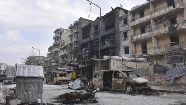 File photo shows damaged buildings and cars in the Ansari neighborhood, east Aleppo.(AP Photo)