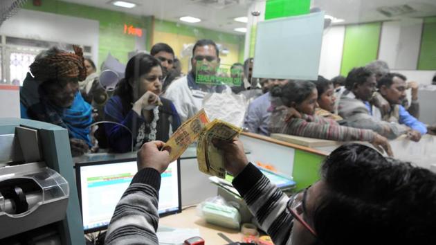 Since November 8, when Prime Minister Narendra Modi announced the invalidation of high-value currency notes, and their replacement with new ones, with assorted (and ever-changing) conditionalities and constraints, they have been hard at work, sometimes even over weekends.(HT Photo) Since November 8, when Prime Minister Narendra Modi announced the invalidation of high-value currency notes, and their replacement with new ones, with assorted (and ever-changing) conditionalities and constraints, they have been hard at work, sometimes even over weekends.(HT Photo)