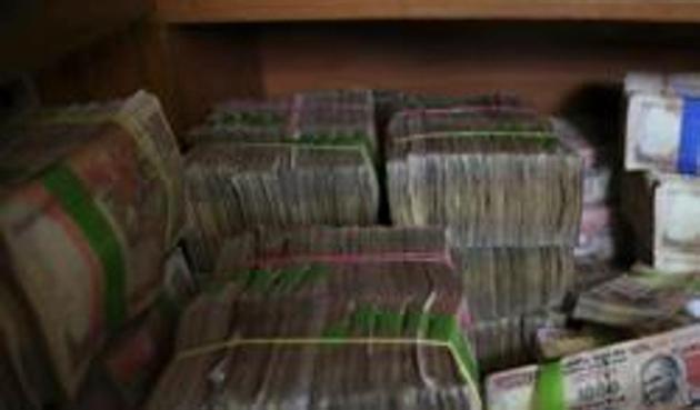 The government is looking to tighten the noose on black-money hoarders in the Union Budget. It may amend the Income Tax Act, allowing the taxman to scrutinise your transactions that are older than six years, said top sources in the tax department. (AP) The government is looking to tighten the noose on black-money hoarders in the Union Budget. It may amend the Income Tax Act, allowing the taxman to scrutinise your transactions that are older than six years, said top sources in the tax department. (AP)