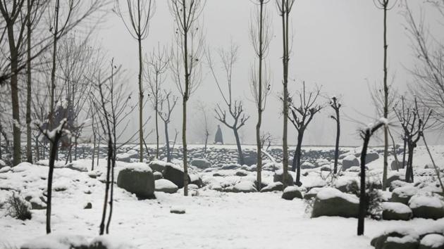 A Kashmiri man walks on a snow covered road on the outskirts of Srinagar, Indian controlled Kashmir, Wednesday, Jan. 4, 2017. Srinagar experienced the first snowfall of the season Wednesday. (/Mukhtar Khan / AP)