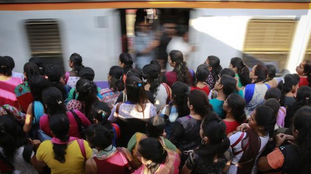 Commuters wait for their train in Mumbai. (AP File Photo) Commuters wait for their train in Mumbai. (AP File Photo)