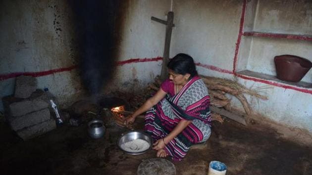 In this photograph taken on October 5, 2015, a tribal widow K Vijaya, who lost her husband in a road accident, prepares food at her home in the village of Peddakunta, some 56 km from Hyderabad. The Telangana government is announced a grant Rs 1,000 monthly wages to distressed lonely women in the state who may be pushed into poverty. (AFP file photo) In this photograph taken on October 5, 2015, a tribal widow K Vijaya, who lost her husband in a road accident, prepares food at her home in the village of Peddakunta, some 56 km from Hyderabad. The Telangana government is announced a grant Rs 1,000 monthly wages to distressed lonely women in the state who may be pushed into poverty. (AFP file photo)