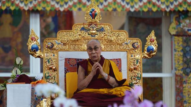 Tibetan spiritual leader the Dalai Lama gestures during a special religious teaching session at Kalachakra in Bodhgaya on Thursday. (AFP PHOTO / Dibyangshu SARKAR) 