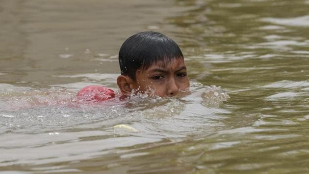 A child swims in floodwaters in Bendang Pak Yong, Malaysia's northeastern town of Tumpat, which borders with Thailand on January 6, 2017. (MOHD RASFAN / AFP) A child swims in floodwaters in Bendang Pak Yong, Malaysia's northeastern town of Tumpat, which borders with Thailand on January 6, 2017. (MOHD RASFAN / AFP)