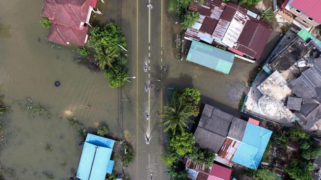 An aerial view shows the flooded area in Jal Besar, Malaysia's northeastern town of Tumpat, which borders Thailand, on January 6, 2017. More than 15,000 people remained stranded in relief centres in northern Malaysia after days of tropical downpours as thousands more headed home to survey the damage wreaked by the floods. (Mohd RASFAN / AFP) An aerial view shows the flooded area in Jal Besar, Malaysia's northeastern town of Tumpat, which borders Thailand, on January 6, 2017. More than 15,000 people remained stranded in relief centres in northern Malaysia after days of tropical downpours as thousands more headed home to survey the damage wreaked by the floods. (Mohd RASFAN / AFP)