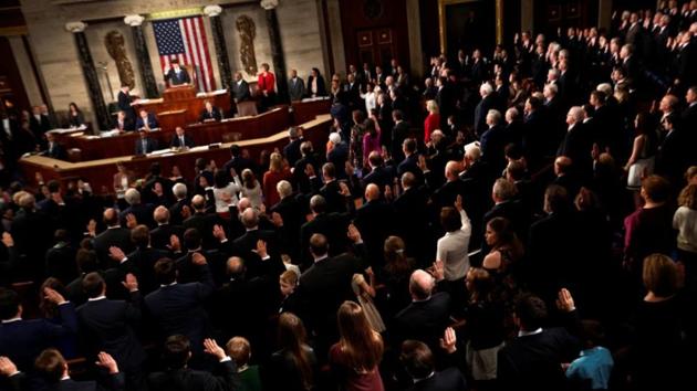 Members of the US House of Representatives are sworn in on the House floor on the first day of the new session of Congress at the US Capitol in Washington. Members of the US House of Representatives are sworn in on the House floor on the first day of the new session of Congress at the US Capitol in Washington.