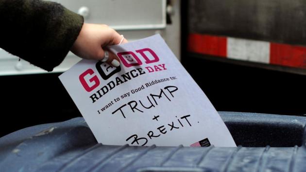 A participant throws a piece of paper reading "Trump and Brexit" into a trash can to be shredded during "Good Riddance Day", New York City, December 28, 2016. Good Riddance Day is an annual event held in New York City for people to shred pieces of paper representing their bad memories or things they want to get rid of before the New Year.(REUTERS)