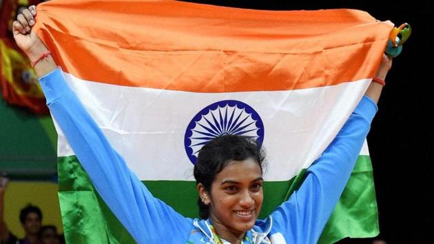 PV Sindhu poses with National flag after winning the silver medal in the badminton women's singles Final at the 2016 Summer Olympics at Rio de Janeiro in Brazil.(PTI File Photo)