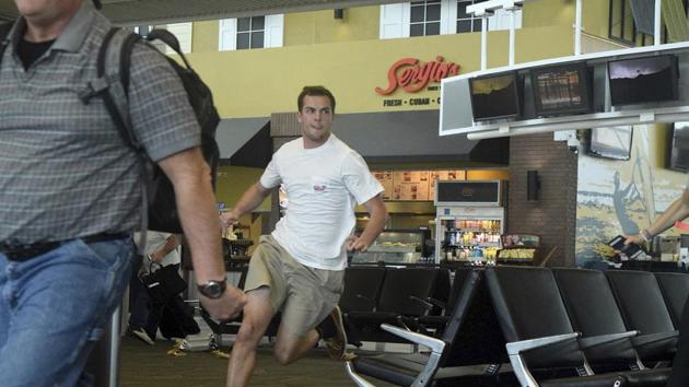 Passengers run for cover in Terminal 1 at Fort Lauderdale–Hollywood International Airport in Florida on January 6, 2017. (AP) Passengers run for cover in Terminal 1 at Fort Lauderdale–Hollywood International Airport in Florida on January 6, 2017. (AP)