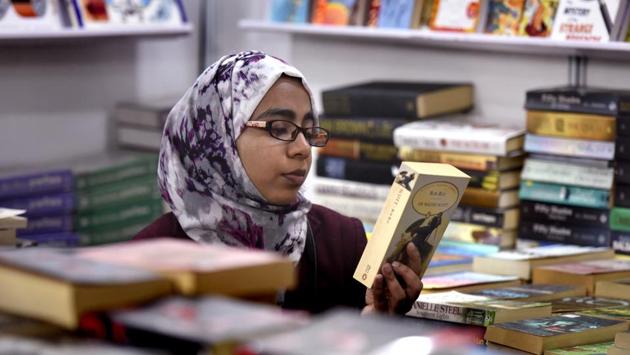 A girl checks out book at the fair. The nine day-long literary extravaganza was inaugurated by minister of state for human resources development Mahendra Nath Pandey. (Virendra Singh Gosain/HT PHOTO) A girl checks out book at the fair. The nine day-long literary extravaganza was inaugurated by minister of state for human resources development Mahendra Nath Pandey. (Virendra Singh Gosain/HT PHOTO)