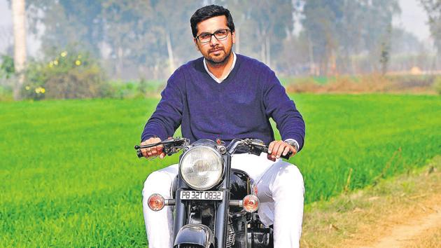 RIDING HIGH ON LEGACY: Youngest Congress candidate Angad Singh Saini on his Royal Enfield motorcycle.Photo by (Keshav Singh/HT Photo) RIDING HIGH ON LEGACY: Youngest Congress candidate Angad Singh Saini on his Royal Enfield motorcycle.Photo by (Keshav Singh/HT Photo)
