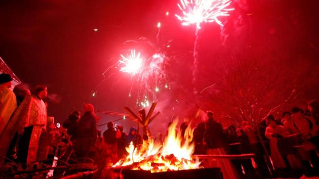 People watch fireworks in front Church of the Holy Prophet Elijah during the eve of the Orthodox Christmas in Sokolac, Bosnia and Herzegovina. (Dado Ruvic/REUTERS)