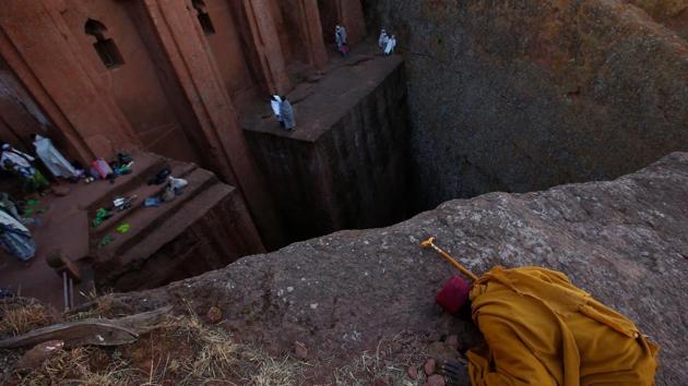 An Ethiopian Orthodox monk prays within a rock hewn church ahead of Ethiopian Christmas. (REUTERS)