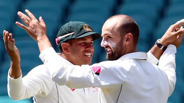 Australia spinner Nathan Lyon (right) celebrate with Usman Khawaja after dismissing Pakistan batsman Younis Khan on Day 5 of the 3rd Test at the SCG, in Sydney on Saturday. Catch cricket score of Australia vs Pakistan 3rd Test, Day 5 here.(AFP)