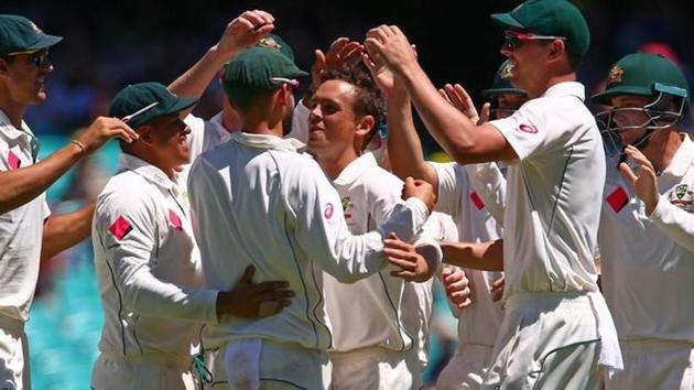 Australia players celebrated after Nathan Lyon took the catch to dismiss Pakistan skipper Misbah-ul-Haq druing Day 5 of the third Test at SCG in Sydney on Saturday.(Reuters)