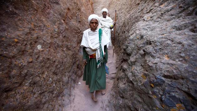 An Ethiopian Orthodox pilgrim arrives for the Ethiopian Christmas Eve vigil around Bete Maryam (House of Mary) monolithic church in Lalibela, Ethiopia. (Tiksa Negeri/REUTERS)