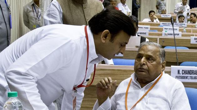 This file photograph taken on September 23 shows CM Akhilesh Yadav (L) listening to his father Mulayam Singh during the Indian National Integration Council meeting in New Delhi. (AFP) This file photograph taken on September 23 shows CM Akhilesh Yadav (L) listening to his father Mulayam Singh during the Indian National Integration Council meeting in New Delhi. (AFP)