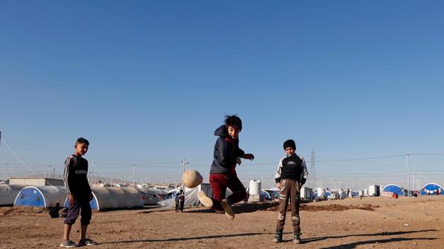 A displaced Iraqi boy who fled the Islamic State stronghold of Mosul, plays at Khazer camp, Iraq. (Reuters Photo) A displaced Iraqi boy who fled the Islamic State stronghold of Mosul, plays at Khazer camp, Iraq. (Reuters Photo)