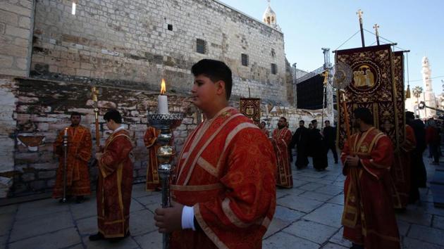 Greek Orthodox clergy parade in Manger Square. (Hazem Bader/AFP)