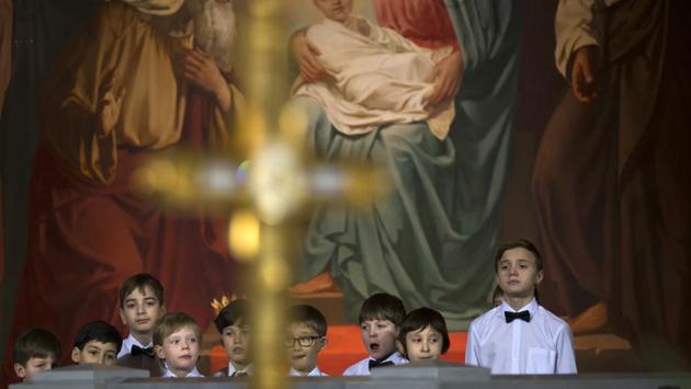 Children listen as Russian Orthodox Patriarch Kirill serves the Christmas Mass in the Christ the Savior Cathedral in Moscow. (Alexander Zemlianichenko/AP)