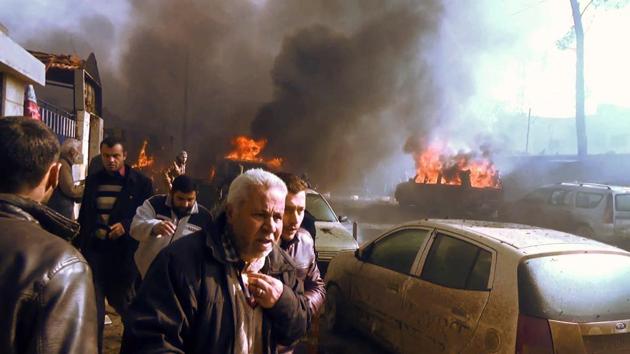 An image grab shows people gathering amidst the debris at the site of a car bomb attack in the rebel-held town of Azaz in northern Syria. (AFP Photo) An image grab shows people gathering amidst the debris at the site of a car bomb attack in the rebel-held town of Azaz in northern Syria. (AFP Photo)