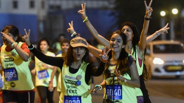 Women participate in a 7km night run to spread awareness on women’s safety in Mumbai on Saturday.  (Kunal Patil / HT Photo) 