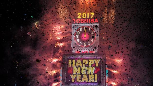 Fireworks and confetti usher in the new year at Times Square in New York, US. (REUTERS)