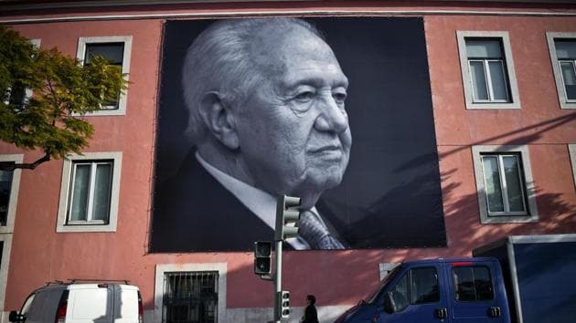 A towering figure: Big pictures of the historic socialist leader and former Portuguese President Mario Soares are displayed on a facade of the Portuguese Socialist party headquarters in Lisbon on Sunday, a day after his death.(AFP)