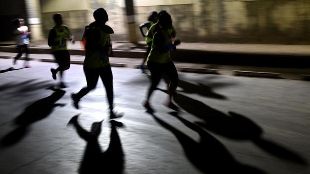 Participants during 7km night run to spread awareness on women's safety at BKC in Mumbai on Saturday.  (Pratik Chorge/HT PHOTO) 