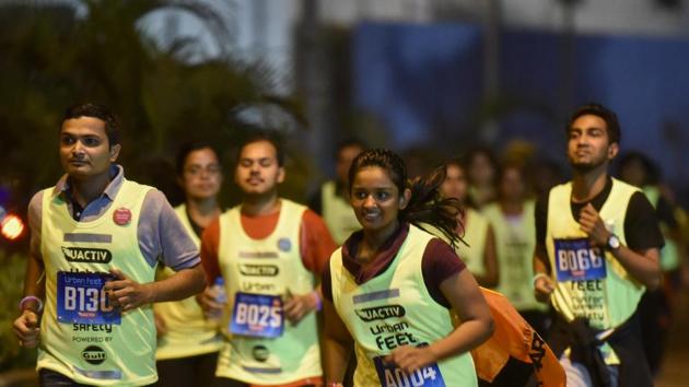 Participants during a 7km night run to spread awareness on women's safety at BKC in Mumbai on Saturday.  (Pratik Chorge/HT PHOTO) 