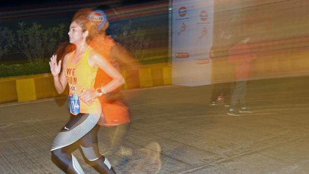 Participants during a 7km night run to spread awareness on women's safety at BKC in Mumbai on Saturday.  (Pratik Chorge/HT PHOTO) 