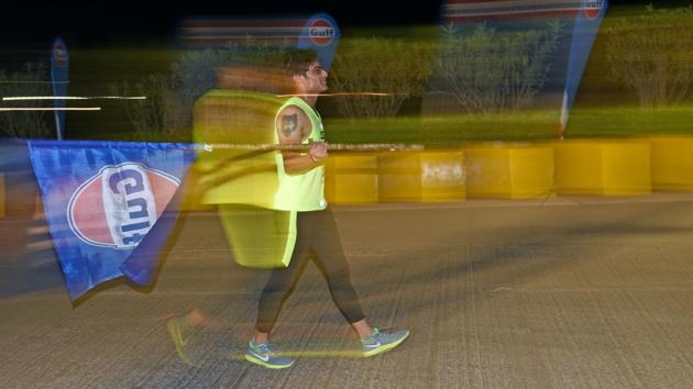 A participant after completing a 7km night run to spread awareness on women's safety in Mumbai on Saturday.  (Pratik Chorge/HT PHOTO) 