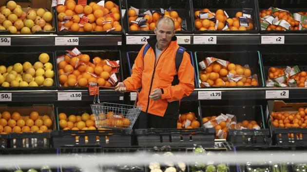 A man shops at a Sainsbury's store in London. (REUTERS)