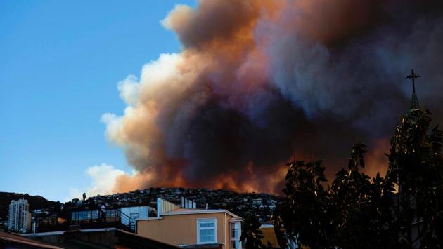 Smoke billows from a forest near Valparaiso, in Chile, on January 02, as the fire threatens to reach the city's port. (AFP)