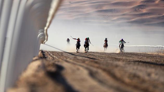 Jockeys compete in a race for purebred Arab horses during the Liwa 2017 Moreeb Dune Festival on January 3 in the Liwa desert, some 250km west of the Gulf emirate of Abu Dhabi. The festival, which attracts participants from around the Gulf region, includes a variety of races (cars, bikes, falcons, camels and horses) or other activities aimed at promoting the country's folklore. (AFP)
