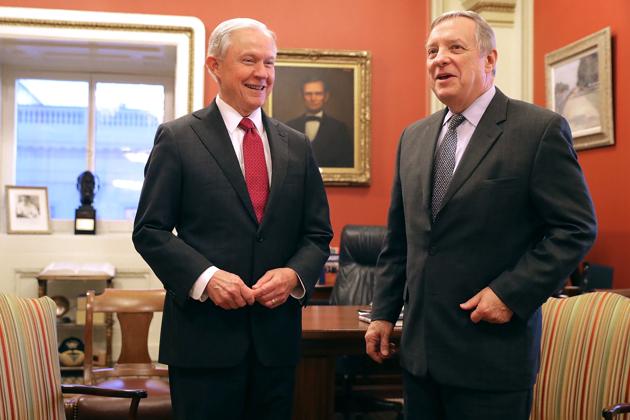 President-elect Donald Trump's choice for attorney general, Senator Jeff Sessions with a Senate member, (AFP) President-elect Donald Trump's choice for attorney general, Senator Jeff Sessions with a Senate member, (AFP)