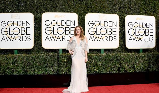 Drew Barrymore in a white cold-shoulder gown. (Valerie Macon/AFP Photo) Drew Barrymore in a white cold-shoulder gown. (Valerie Macon/AFP Photo)