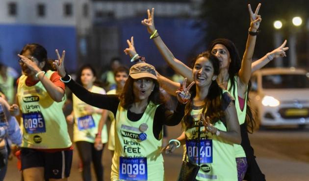 Participants at Urban Feet - Run for Women’s Safety event pause to pose for photographs and cheer fellow runners during the midnight run at BKC on Saturday. (Kunal Patil/HT) Participants at Urban Feet - Run for Women’s Safety event pause to pose for photographs and cheer fellow runners during the midnight run at BKC on Saturday. (Kunal Patil/HT)
