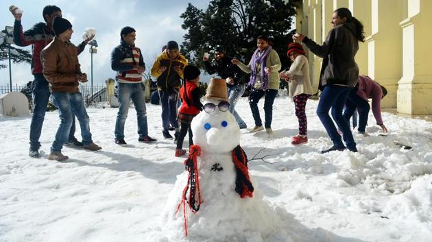 People play with snow in Shimla. (Deepak Sansta/HT Photo) 