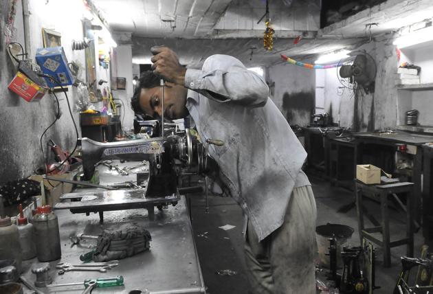 A sewing machine manufacturing unit in Lakkar Bazaar, Ludhiana. Seeing a substantial drop in sales, owner Ravi Arora laid off half a dozen workers and is now managing with just three workers in the assembling section.