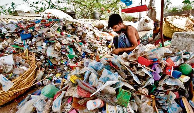 A rag-picker sorts through plastic bottles and polythene bags near a garbage land fill. (AFP File Photo) A rag-picker sorts through plastic bottles and polythene bags near a garbage land fill. (AFP File Photo)