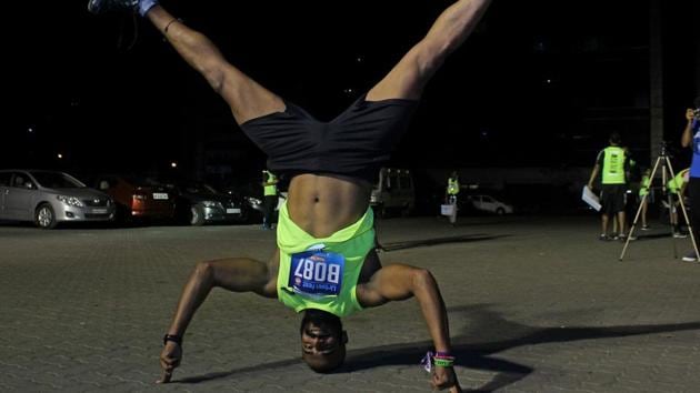 One of the participants does a headstand during the event. (Pratik Chorge/HT PHOTO) One of the participants does a headstand during the event. (Pratik Chorge/HT PHOTO)