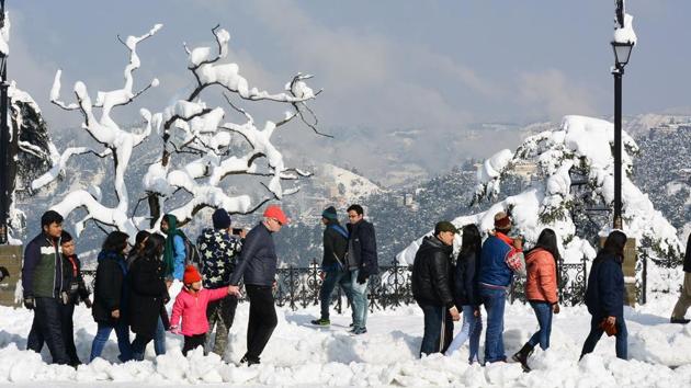 Tourists after heavy snowfall at Ridge, Shimla.  (Deepak Sansta / Ht photo) 